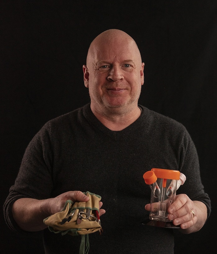Man holding scientific instruments